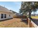 Spacious backyard featuring a privacy fence, mature tree, and ample space for outdoor activities at 1516 Oldenburg Dr, Mount Pleasant, SC 29466