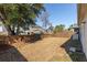 Large backyard with wooden fence, grass and a mature shade tree at 1516 Oldenburg Dr, Mount Pleasant, SC 29466