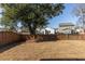 Large backyard with wooden fence, grass and a mature shade tree at 1516 Oldenburg Dr, Mount Pleasant, SC 29466