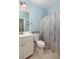 Powder blue bathroom featuring a shower over bath and a white vanity and basin at 1516 Oldenburg Dr, Mount Pleasant, SC 29466