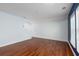 Spacious room featuring blue accent wall, wood floors, and windows for great natural light at 1516 Oldenburg Dr, Mount Pleasant, SC 29466