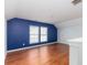 Spacious room featuring blue accent wall, wood floors, and windows for great natural light at 1516 Oldenburg Dr, Mount Pleasant, SC 29466