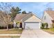 Charming single-story home with a two-car garage and well-maintained front yard at 1516 Oldenburg Dr, Mount Pleasant, SC 29466