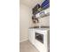 Convenient laundry room setup with machines, storage shelves and tiled floors at 1516 Oldenburg Dr, Mount Pleasant, SC 29466
