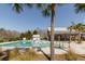 Community pool surrounded by lush landscaping, clubhouse, and plenty of seating for residents and guests at 1516 Oldenburg Dr, Mount Pleasant, SC 29466