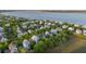 Aerial view of waterfront homes surrounded by mature trees, near the Charleston harbor at 1543 Wando Landing St, Charleston, SC 29492