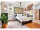 Cozy bedroom featuring a queen bed, decorative accents, and an en suite bathroom at 1543 Wando Landing St, Charleston, SC 29492