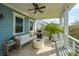 Covered outdoor patio with a grill, comfortable lounge seating, and scenic views at 1543 Wando Landing St, Charleston, SC 29492