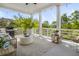 Covered outdoor patio with comfortable seating, grill, and serene wooded views at 1543 Wando Landing St, Charleston, SC 29492