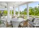 Outdoor covered patio featuring comfortable seating and dining areas with tranquil views at 1543 Wando Landing St, Charleston, SC 29492