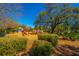 Fun playground with swings and slides, surrounded by lush greenery and large shade trees at 1543 Wando Landing St, Charleston, SC 29492