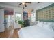 Inviting bedroom with a queen-sized bed, hardwood floors, and sunny windows at 1543 Wando Landing St, Charleston, SC 29492