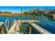 Scenic dock view with boat lift, featuring waterfront homes and lush marsh views for relaxing and enjoying the water at 1543 Wando Landing St, Charleston, SC 29492