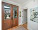Elegant entryway featuring hardwood floors, a decorative rug, and a view of the front porch at 1543 Wando Landing St, Charleston, SC 29492