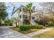 Beautiful two-story home with double porches, mature landscaping, and a welcoming driveway at 1543 Wando Landing St, Charleston, SC 29492