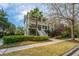 Lovely two-story home with double porches, a well-manicured lawn, and a charming neighborhood setting at 1543 Wando Landing St, Charleston, SC 29492