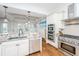 Modern kitchen with granite countertops, stainless steel appliances, and hardwood floors at 1543 Wando Landing St, Charleston, SC 29492