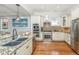 Bright kitchen featuring stainless steel appliances, granite countertops, and custom cabinetry at 1543 Wando Landing St, Charleston, SC 29492