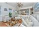 Bright and airy living room featuring a large sectional sofa and open floor plan at 1543 Wando Landing St, Charleston, SC 29492
