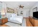 Spacious main bedroom with hardwood floors, neutral walls and a decorative oyster painting on the wall at 1543 Wando Landing St, Charleston, SC 29492