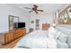 Comfortable main bedroom featuring hardwood floors, a ceiling fan, and stylish furnishings at 1543 Wando Landing St, Charleston, SC 29492