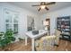 Cozy home office with hardwood floors, ample natural light, and built-in shelving at 1543 Wando Landing St, Charleston, SC 29492