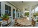 Charming covered patio with outdoor seating and view of the surrounding landscape at 1543 Wando Landing St, Charleston, SC 29492