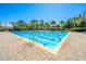 Inviting community pool with clear blue water, surrounded by lounge chairs, trees, and a covered area for relaxation at 1543 Wando Landing St, Daniel Island, SC 29492