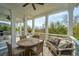 Relaxing covered porch with a dining table, chairs, outdoor sofa and scenic views at 1543 Wando Landing St, Charleston, SC 29492