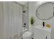 Charming bathroom with new vanity, sink, stylish fixtures, tub and shower with decorative curtain at 1563 Traywick Ave, Johns Island, SC 29455
