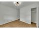 Bright bedroom featuring a neutral palette, wood floors, modern light fixture, and closet at 1563 Traywick Ave, Johns Island, SC 29455
