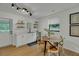 Bright dining area with open access to the kitchen and a view to the outdoors at 1563 Traywick Ave, Johns Island, SC 29455