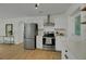 Kitchen featuring stainless steel appliances, white cabinets, and quartz countertops at 1563 Traywick Ave, Johns Island, SC 29455