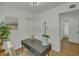 Bright office featuring a gray desk, wood floors, modern light fixture, and a closet at 1563 Traywick Ave, Johns Island, SC 29455