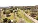 Sprawling aerial view of property with house, shed, and spacious yard with mature trees at 16 Baldwin Ln, Green Pond, SC 29446