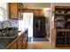 Updated kitchen with stainless steel refrigerator and ample cabinet space at 16 Baldwin Ln, Green Pond, SC 29446