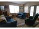 Inviting living room with comfortable seating, area rug, and plenty of natural light at 16 Baldwin Ln, Green Pond, SC 29446