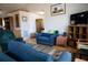 Cozy living room with blue furniture, hardwood floors, and ample natural light at 16 Baldwin Ln, Green Pond, SC 29446