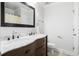 Bathroom featuring a dual sink vanity with marble countertops and dark cabinetry at 1713 Boone Hall Dr # I9, Charleston, SC 29407