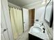 Bright bathroom with dual sinks, marble countertops, and a separate shower area at 1713 Boone Hall Dr # I9, Charleston, SC 29407