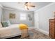 Neutral bedroom showcases a cozy bed, complemented by natural light and carpet at 1713 Boone Hall Dr # I9, Charleston, SC 29407