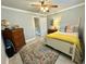 Well decorated bedroom featuring a ceiling fan, hard wood flooring, and a white bed frame at 1713 Boone Hall Dr # I9, Charleston, SC 29407