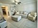 Comfortable living room featuring neutral decor, a built-in bookcase, and tile flooring at 1713 Boone Hall Dr # I9, Charleston, SC 29407