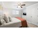 Bedroom boasts an upholstered headboard and bright natural lighting with a ceiling fan at 1713 Boone Hall Dr # I9, Charleston, SC 29407