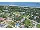An aerial view showing a coastal community, with sandy beaches and beautiful ocean views in the distance at 1714 Middle St, Sullivans Island, SC 29482