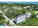 Aerial view of coastal home with pool surrounded by mature trees, showcasing its private setting at 1714 Middle St, Sullivans Island, SC 29482