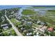 Breathtaking aerial view of a waterfront community with lush green landscapes, winding waterways and multiple boat docks at 1714 Middle St, Sullivans Island, SC 29482