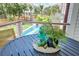 Inviting balcony seating area overlooking a sparkling pool, perfect for relaxation at 1714 Middle St, Sullivans Island, SC 29482