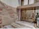Close-up of bar with exposed brick, marble countertop, wooden shelf, and decorative backsplash at 1714 Middle St, Sullivans Island, SC 29482