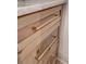 Close-up of wooden bar cabinets with brass hardware and elegant marble countertop at 1714 Middle St, Sullivans Island, SC 29482
